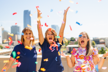 St. Anthony Hospital employees celebrating with confetti