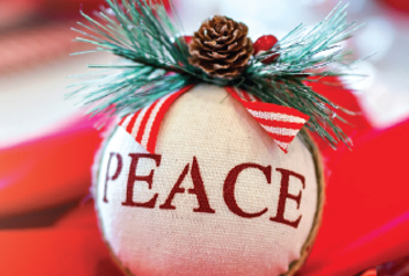 white ornament with PEACE on it